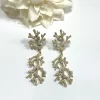 PENDIENTES CORAL ACERO DORADO